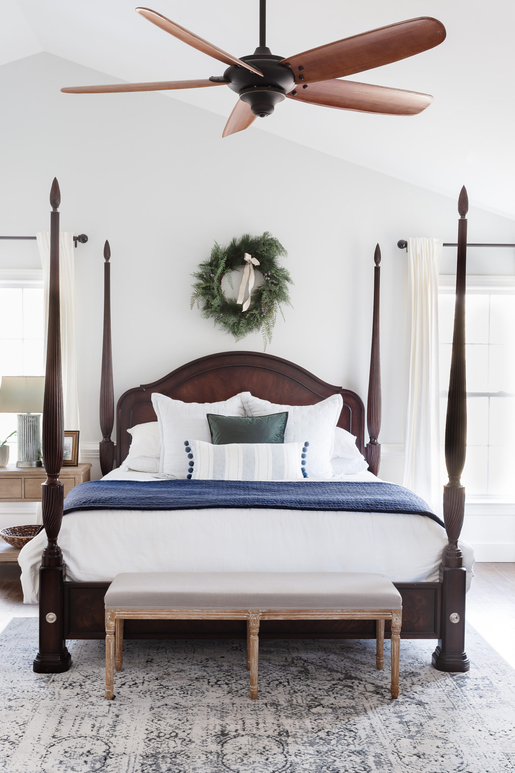 Christmas wreath above bed in bedroom