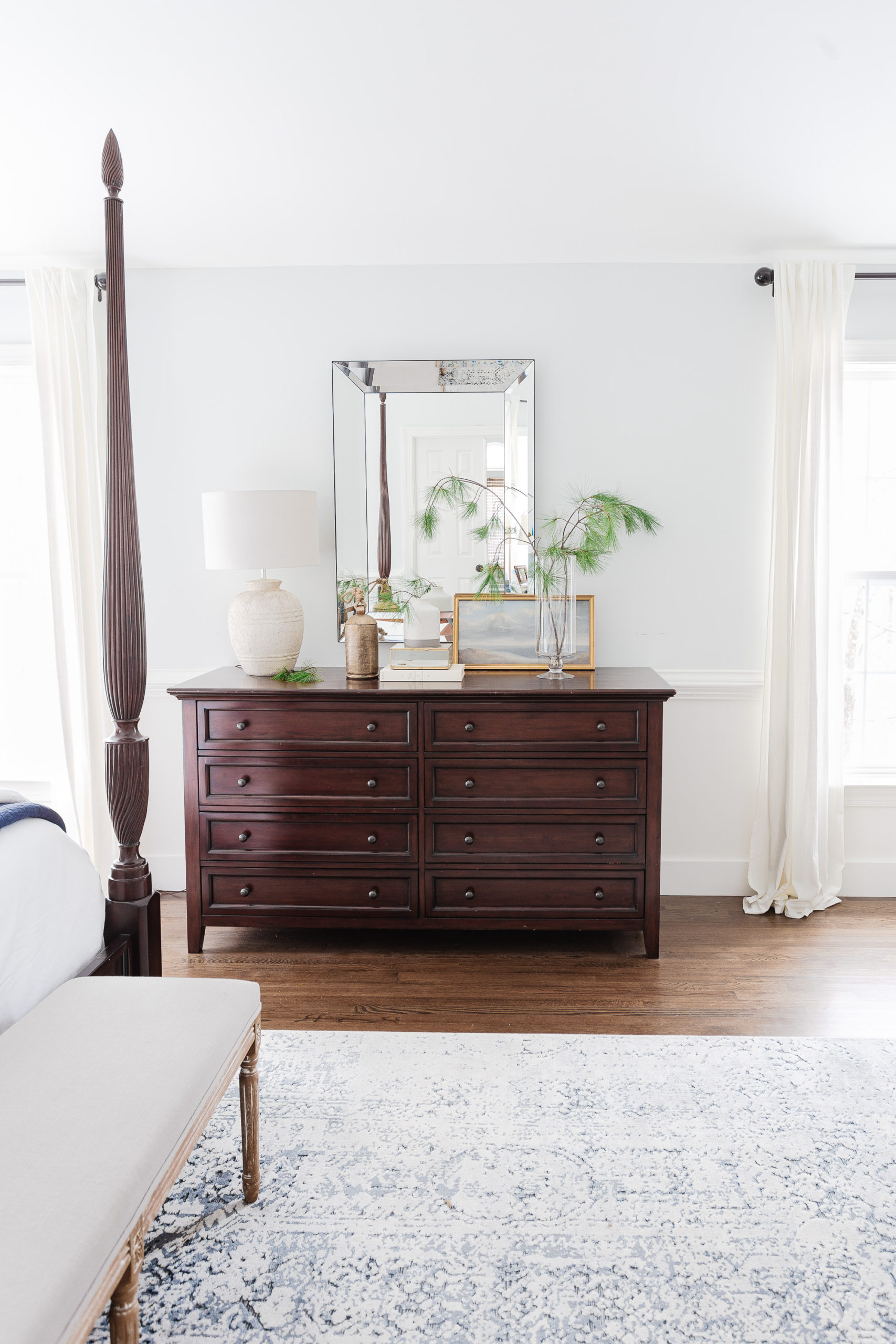 Mahogany dresser and mirror in bedroom
