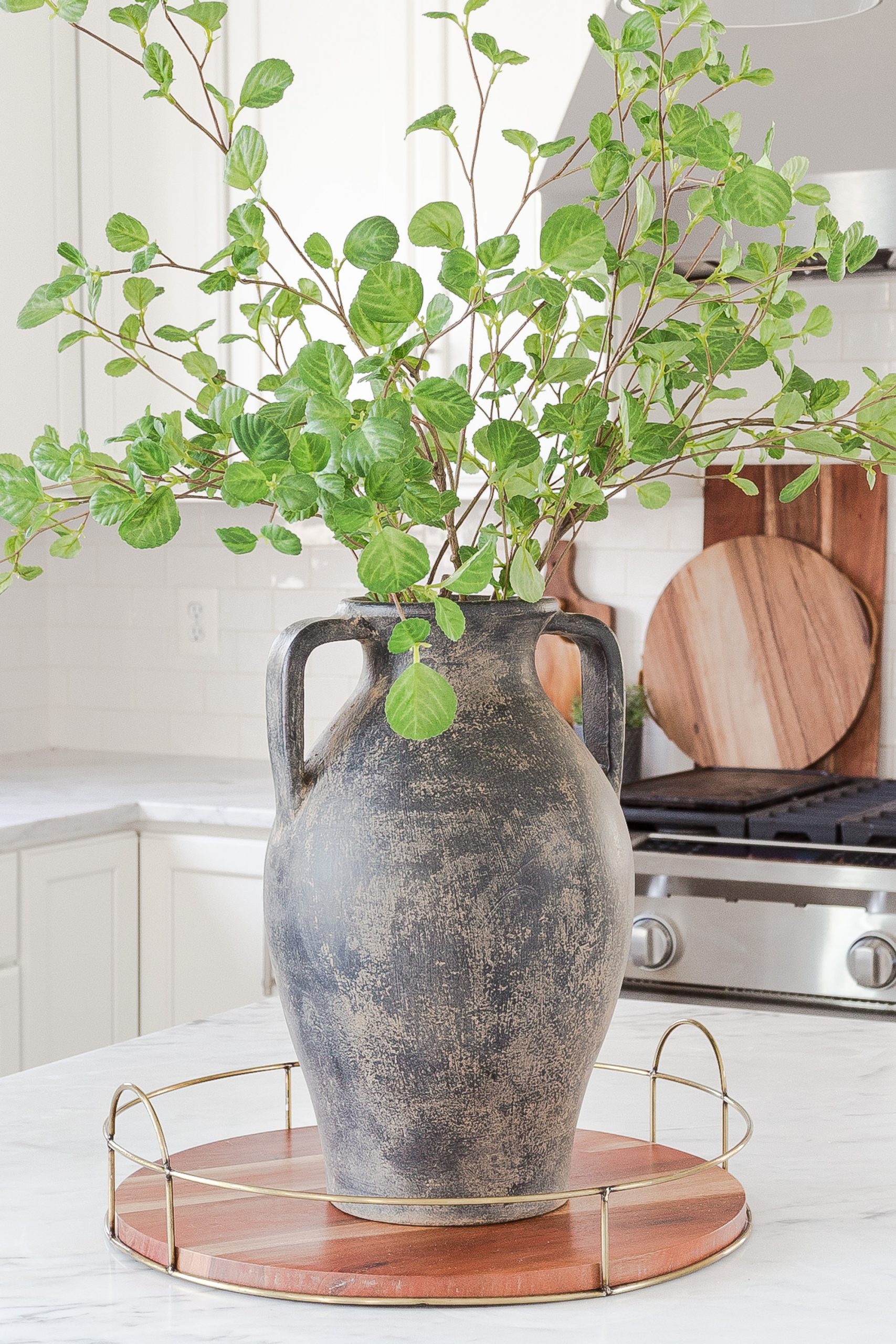 diy black weathered vase on white kitchen counter