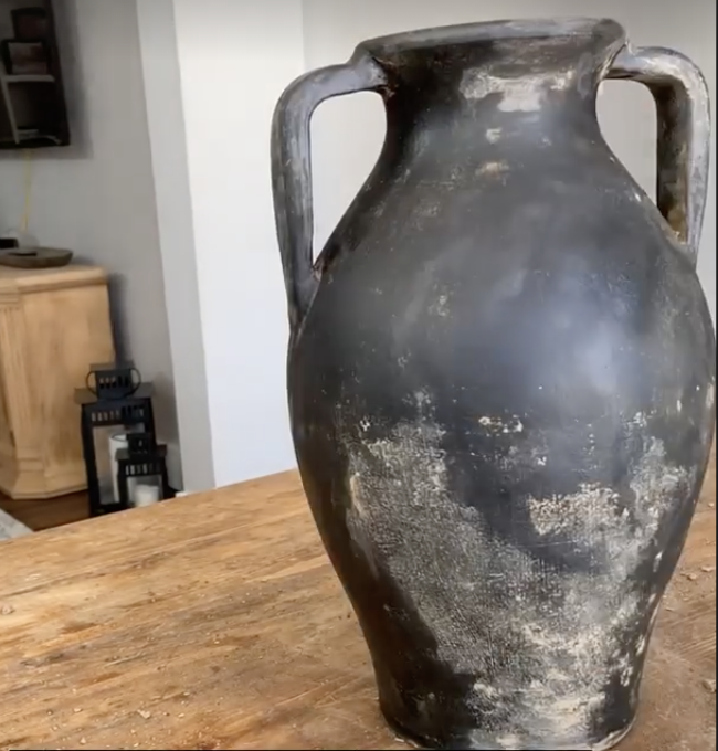 weathered black vase