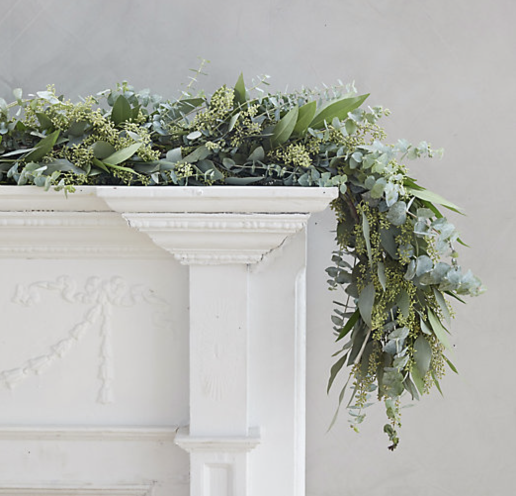 Eucalyptus garland on white vintage fireplace