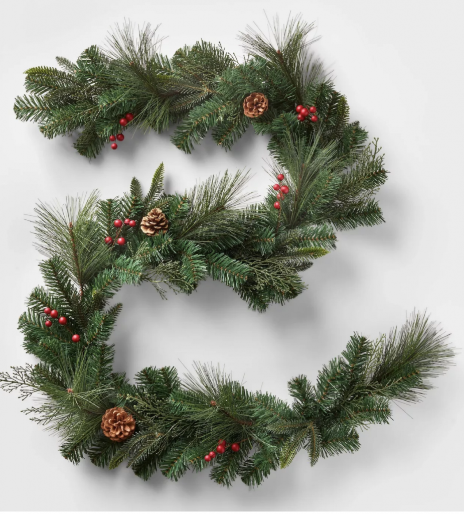 green garland with little red berries and pinecones