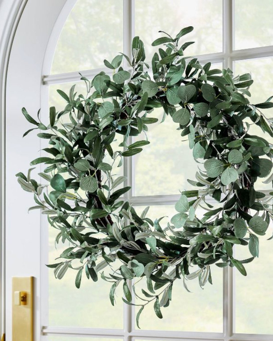 green wreath on white door