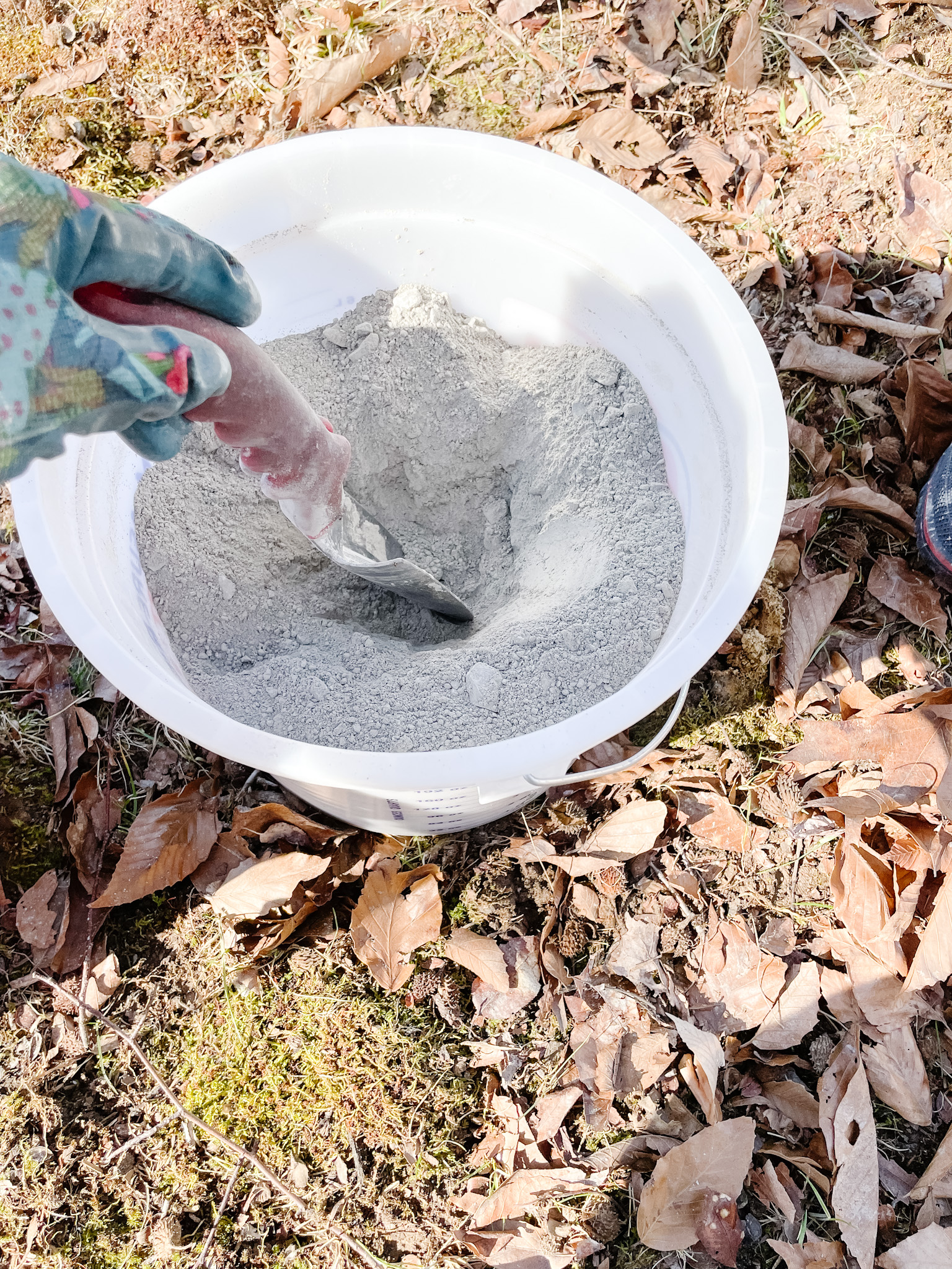 Mixing concrete in bucket