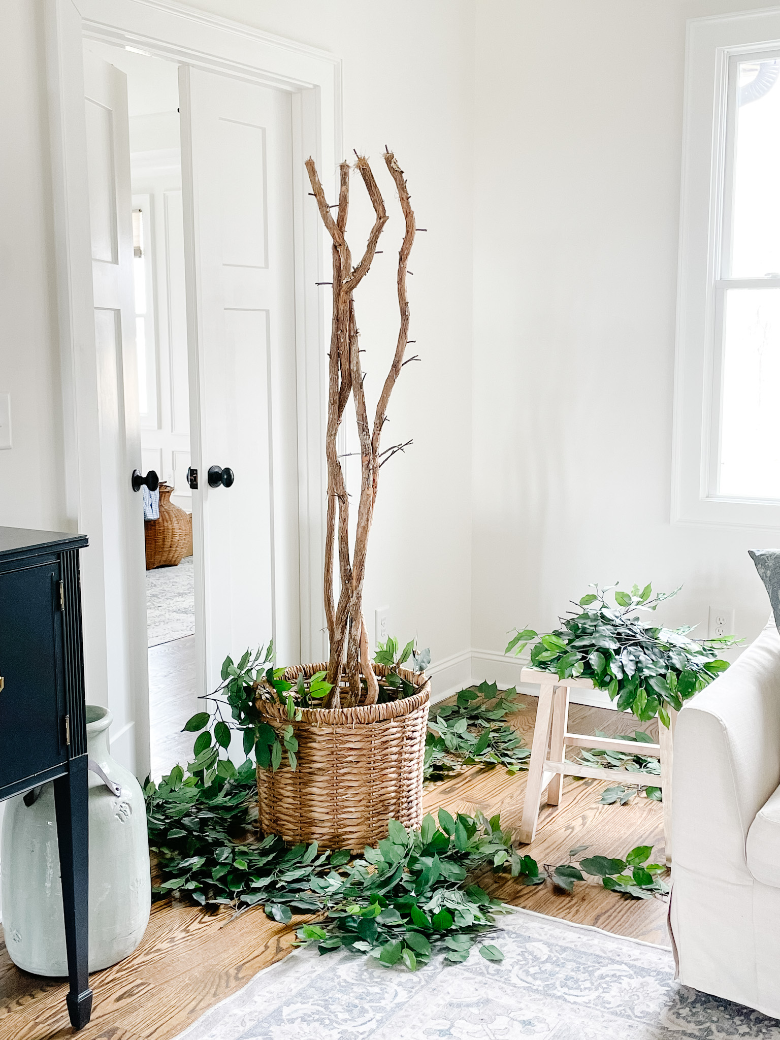 faux ficus tree with leaves removed and laying on the floor