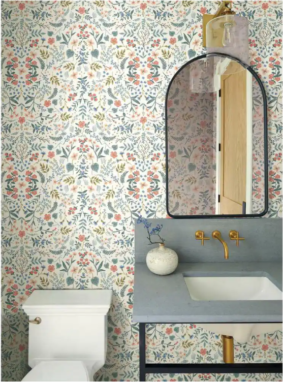 Floral paper in bathroom with blue sink