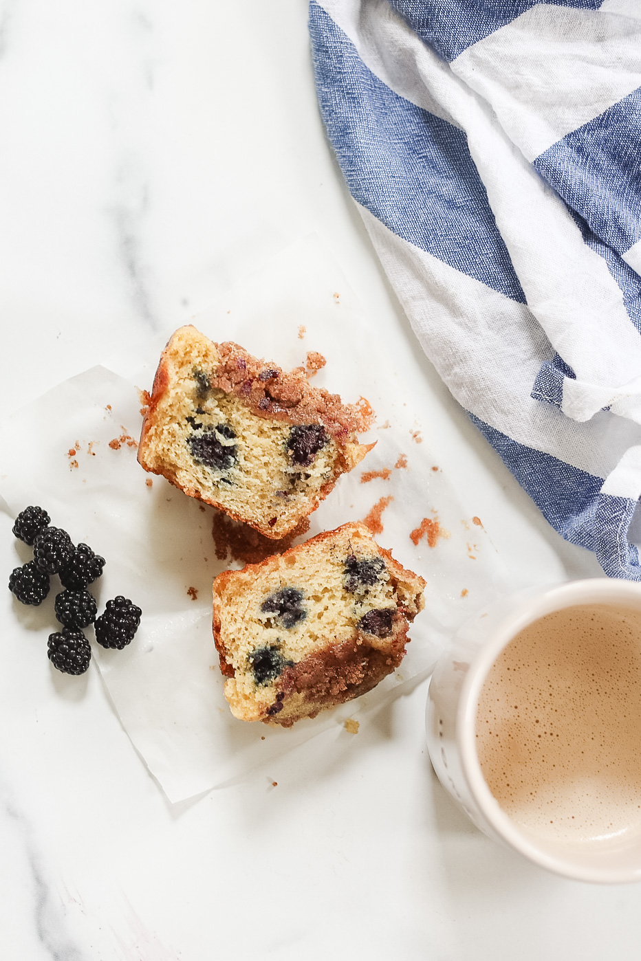 Blackberry Greek Yogurt Muffins on counter next to coffee