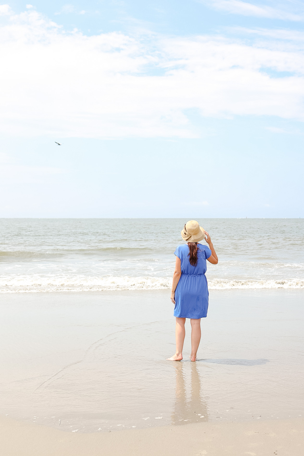 lady in blue dress on beach