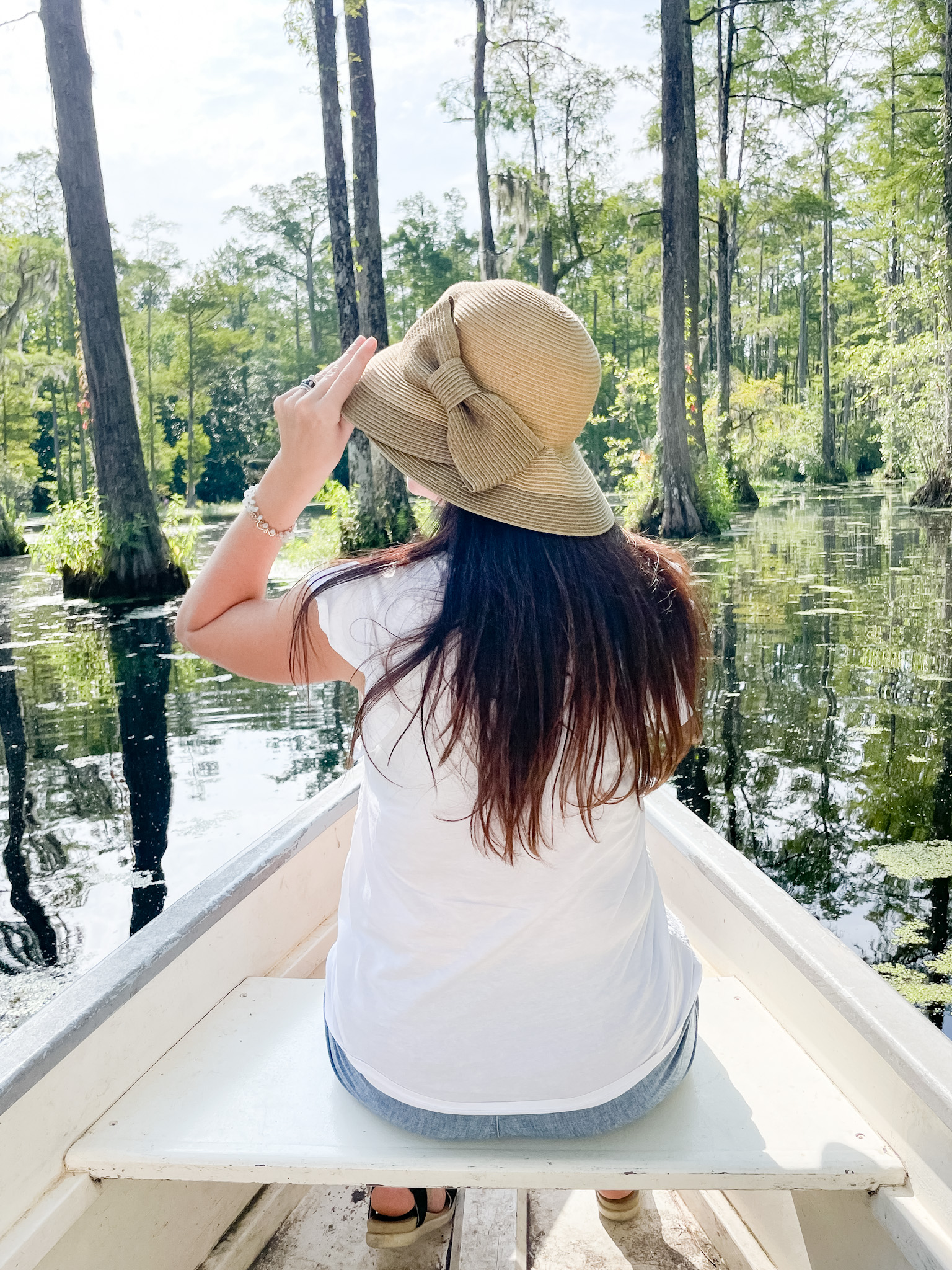 lady in boat wearing a hat