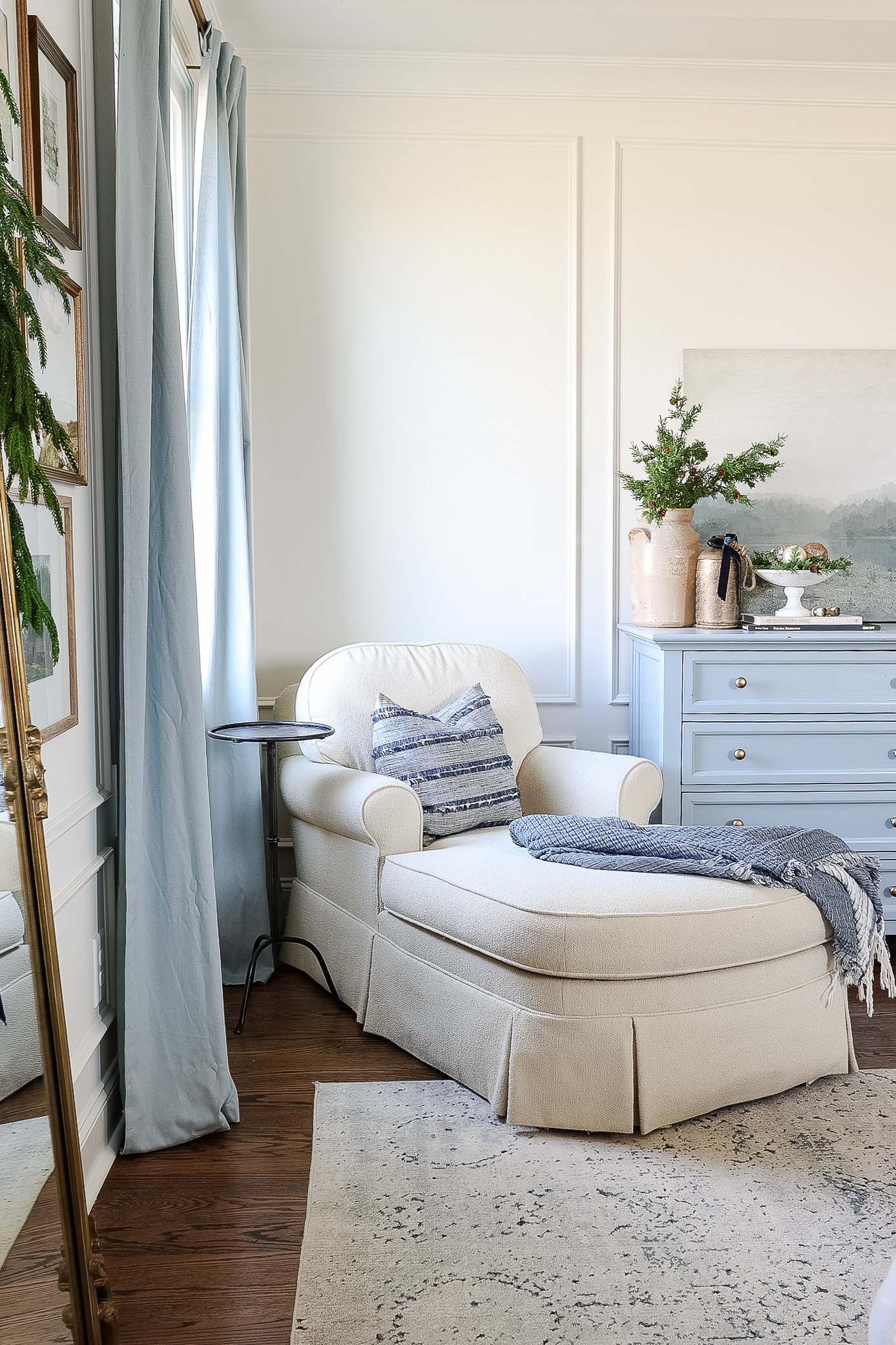 blue and white bedroom with chaise lounge and christmas bedroom decor