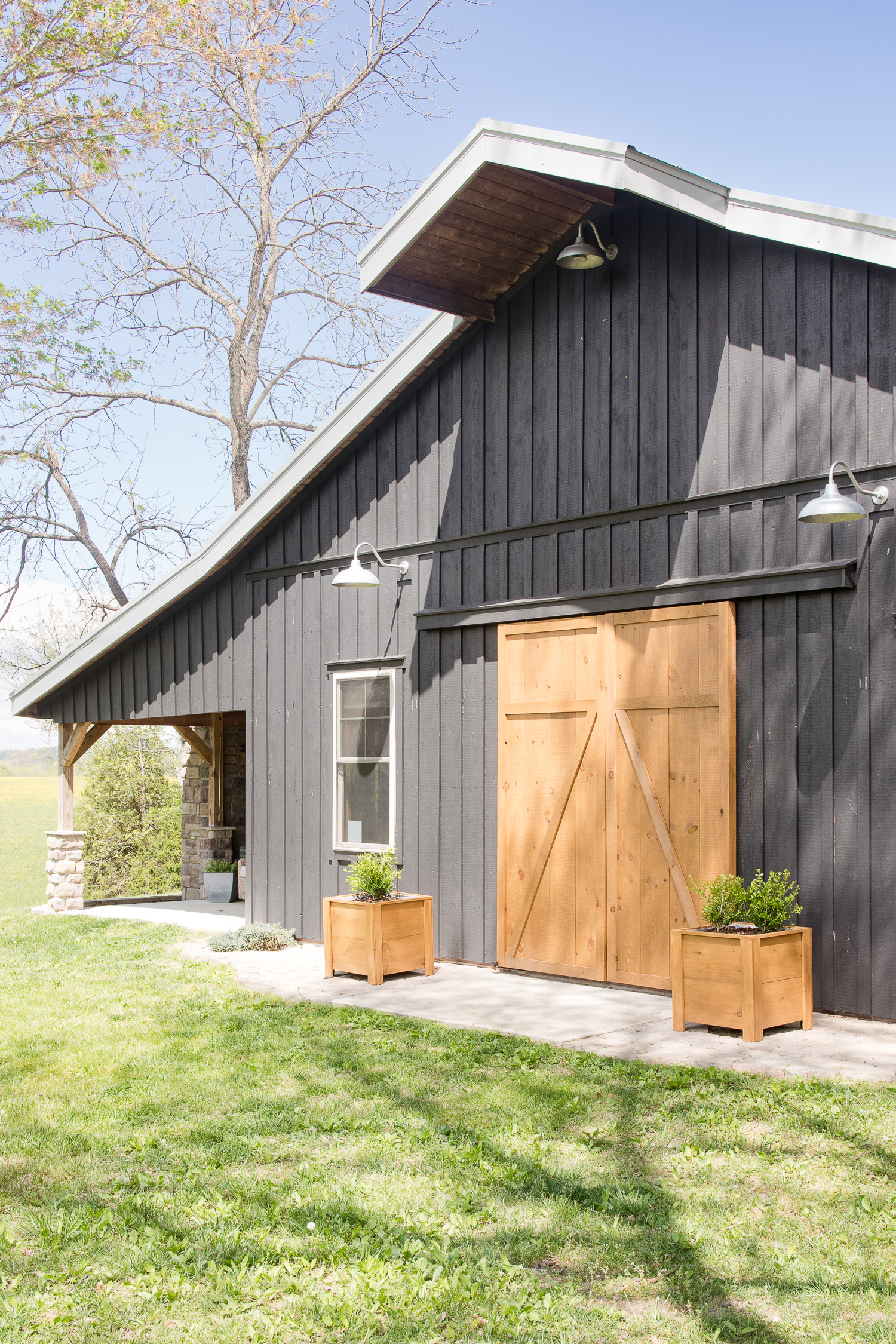 black barn with wood doors