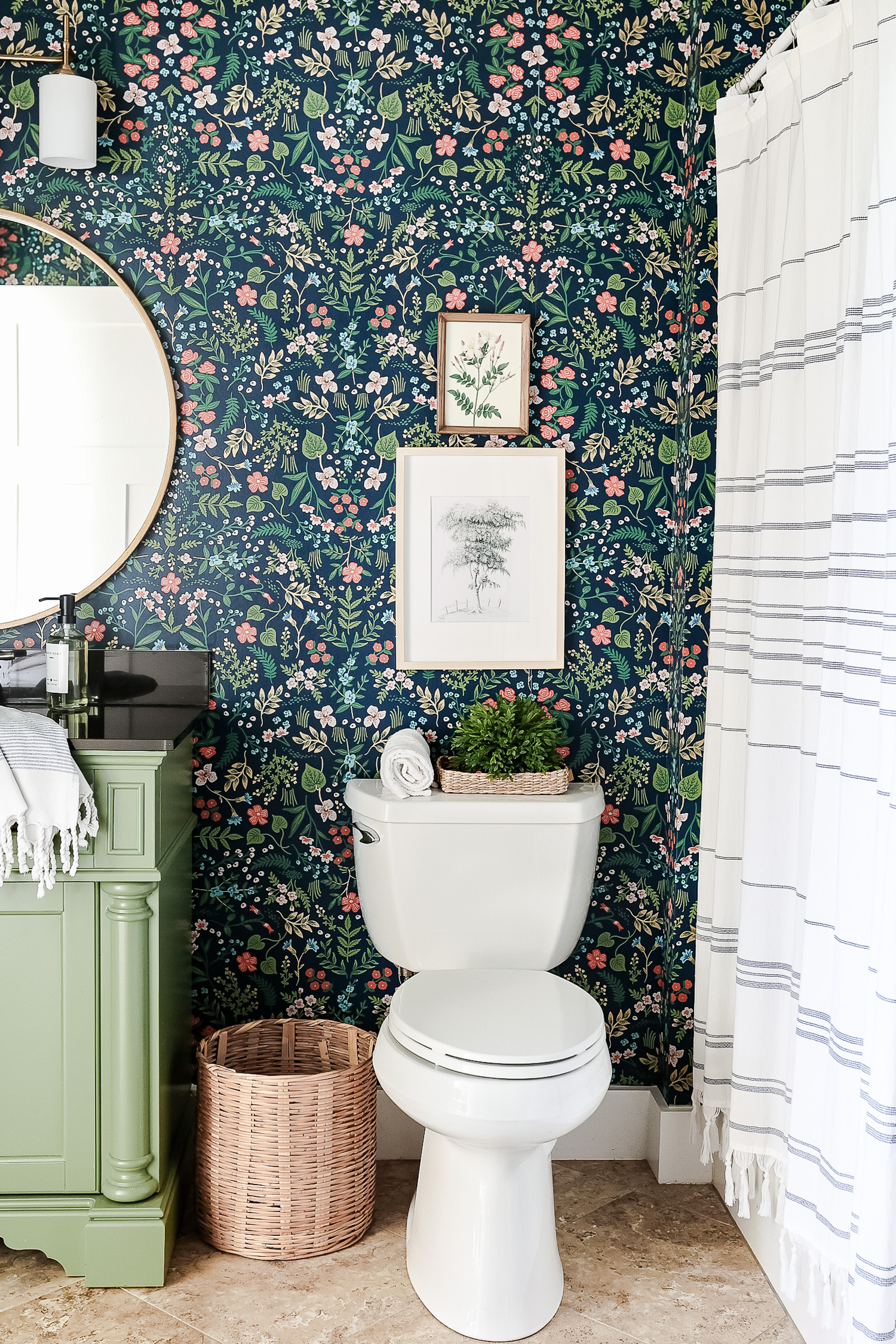 blue floral wallpaper bathroom with green vanity