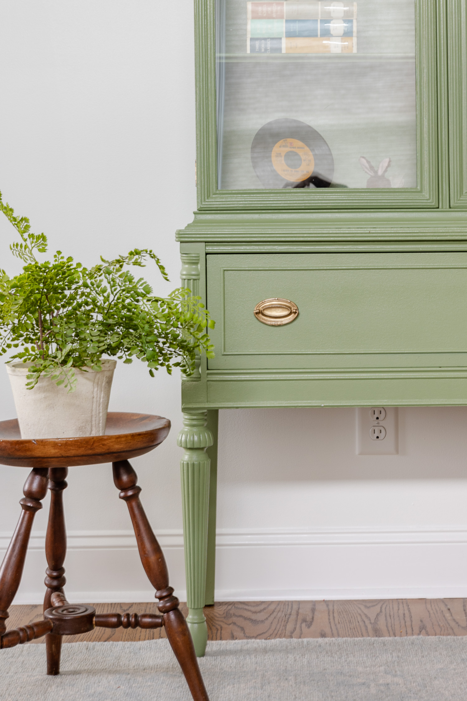 sherwin williams artichoke painted cabinet with antique stool