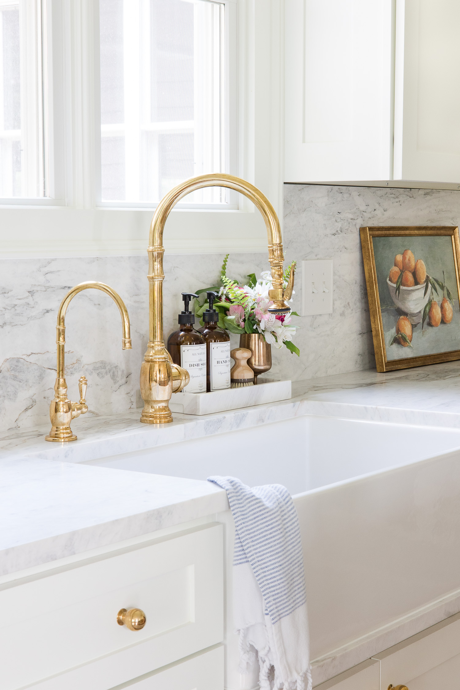 brass kitchen faucet with farmhouse sink