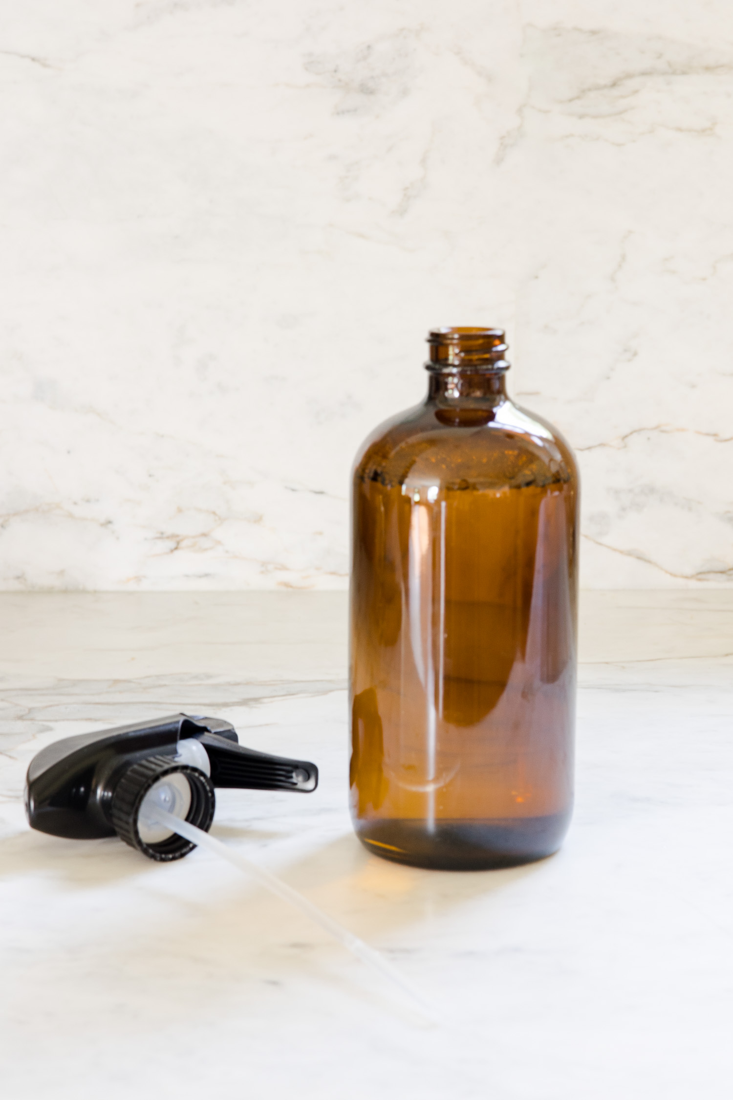 amber glass spray bottle sitting on countertop