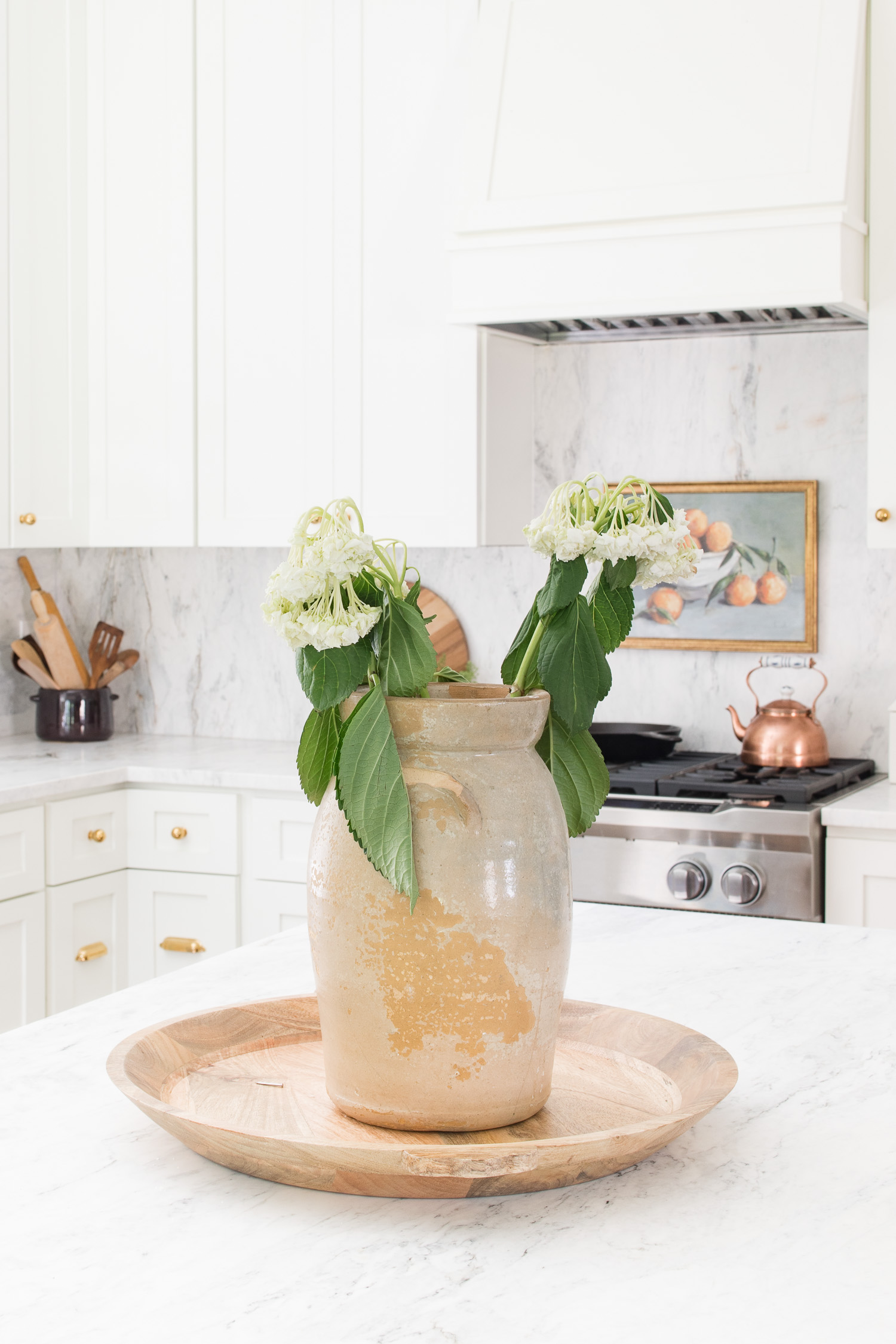 wilted hydrangea in vase on kitchen countertop