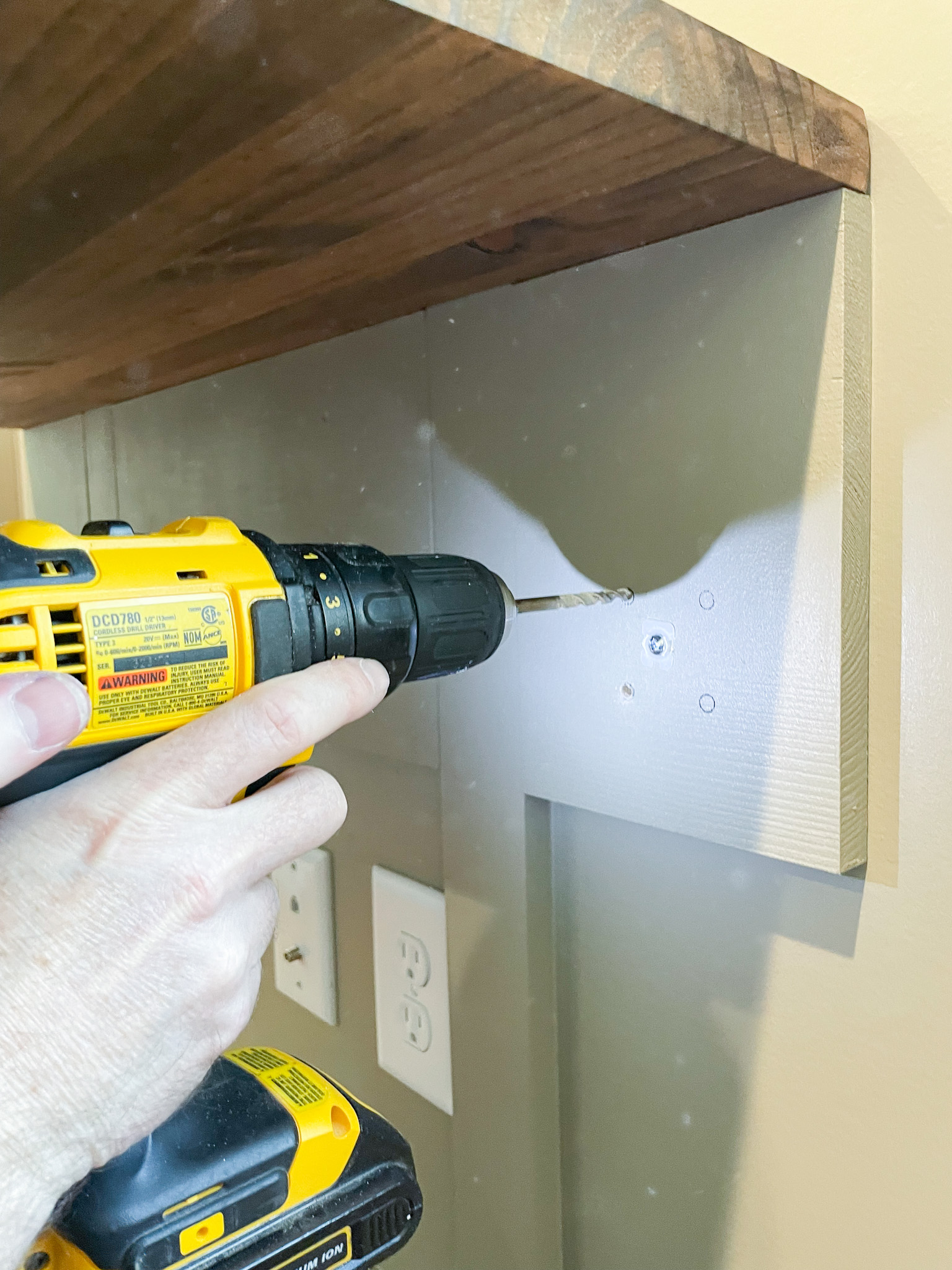 predrilling for bolts into wall