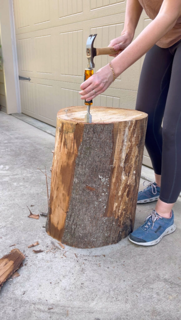 removing bark from tree stump with chisel