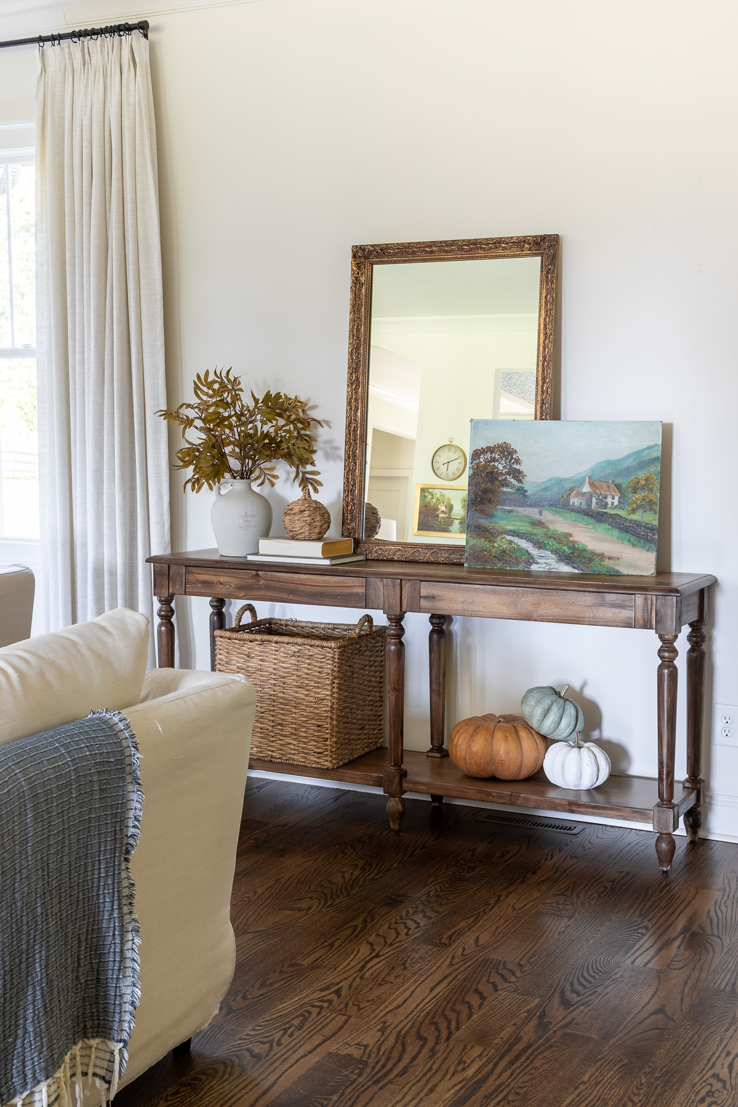 walnut gel stain console table with decor in living room