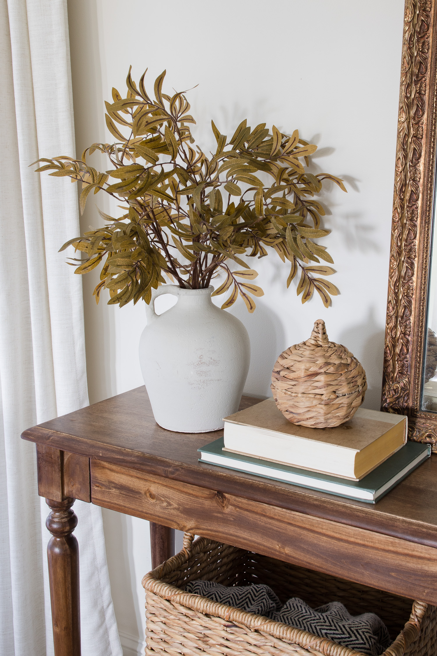 walnut gel stain console table with decor in living room