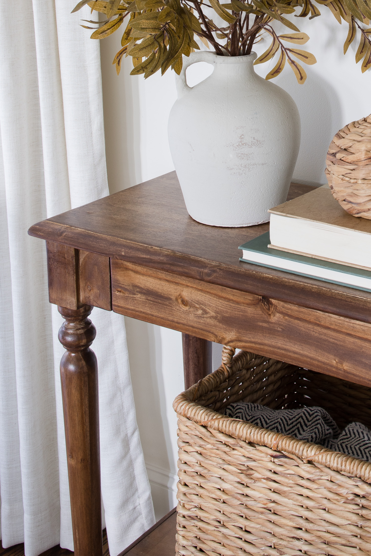 walnut gel stain console table with decor in living room