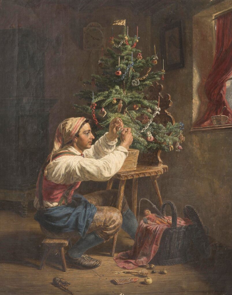 man putting ornaments on christmas tree