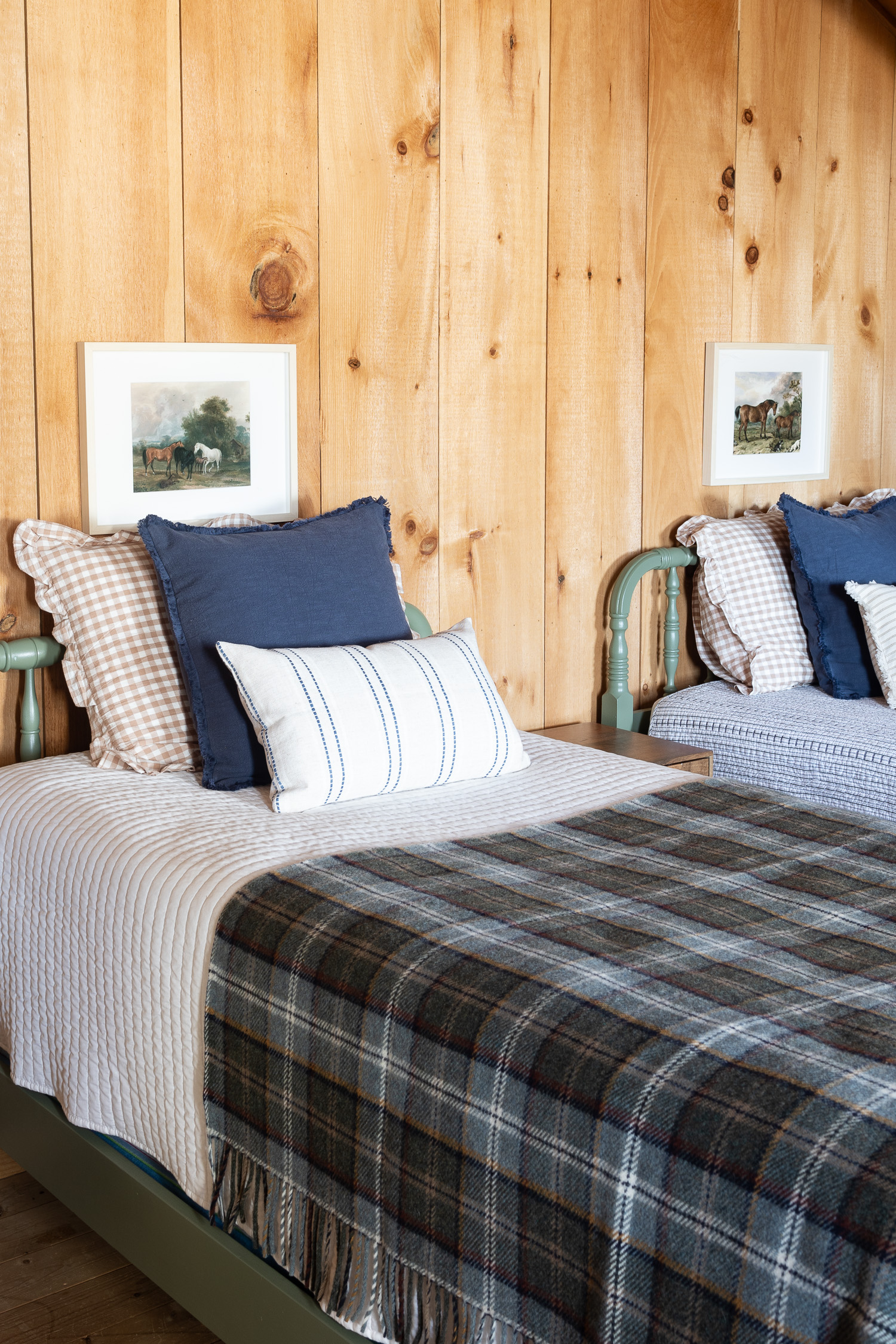 framed vintage horse print above twin beds