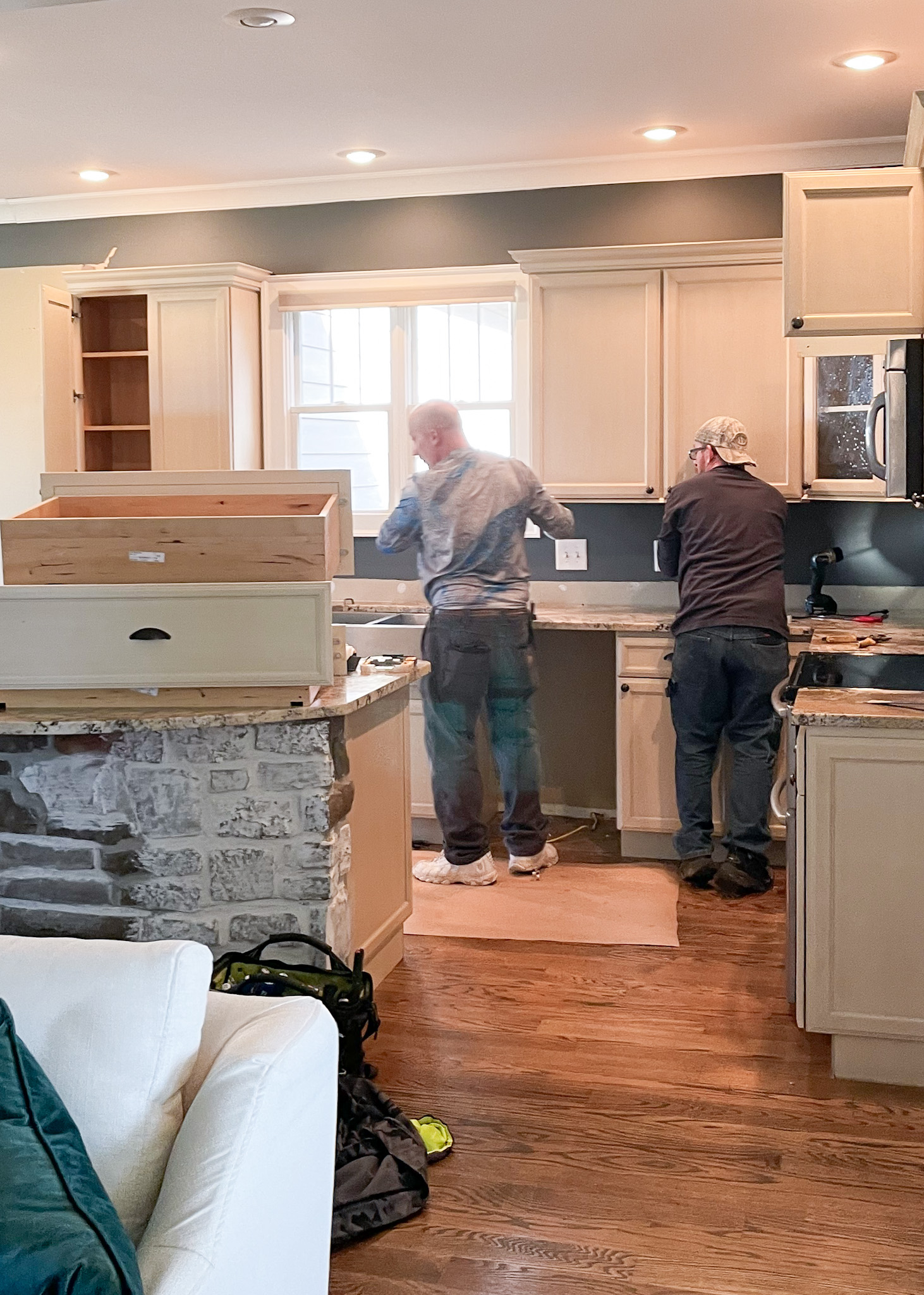 workers remodeling kitchen
