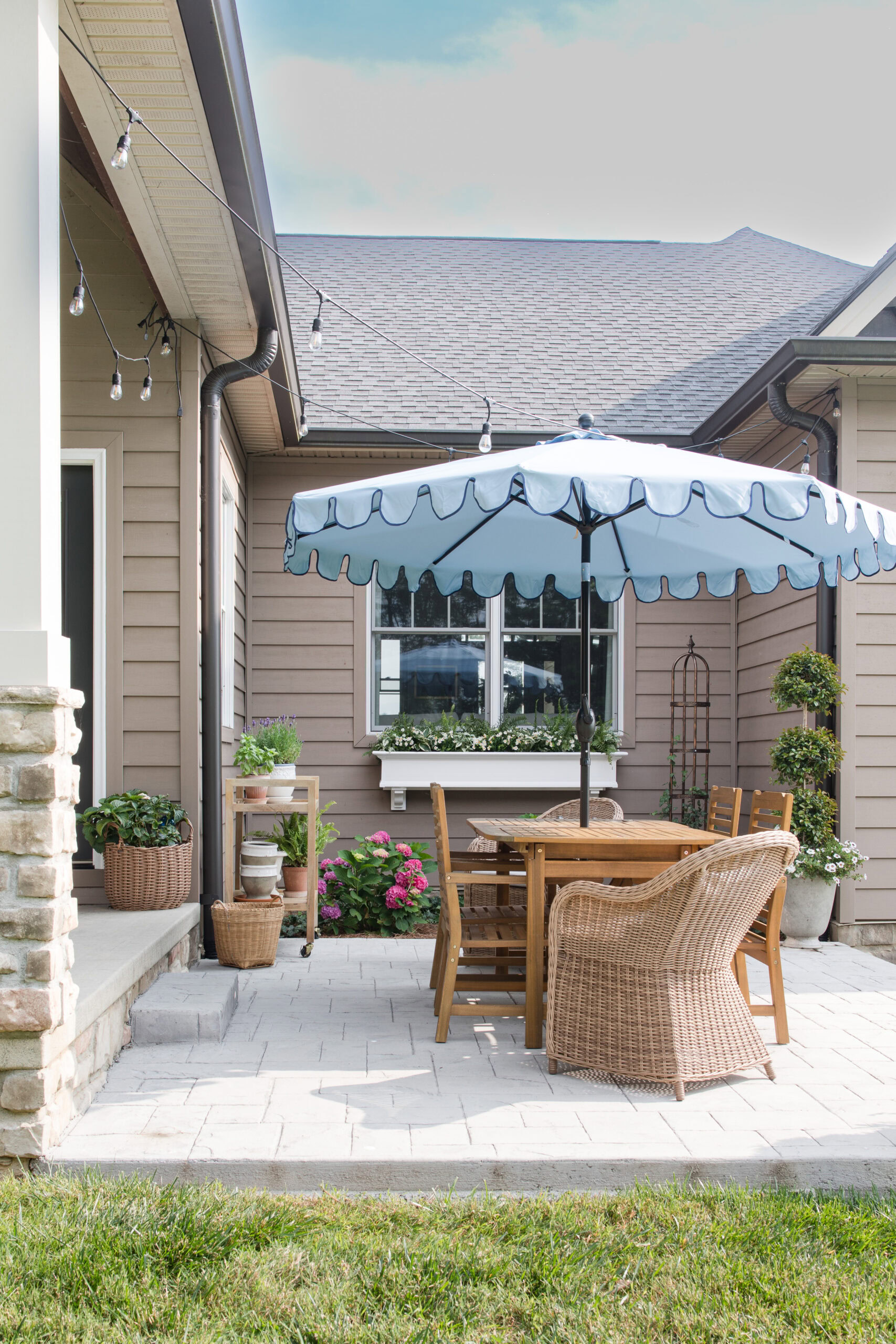 concrete patio with table and umbrella