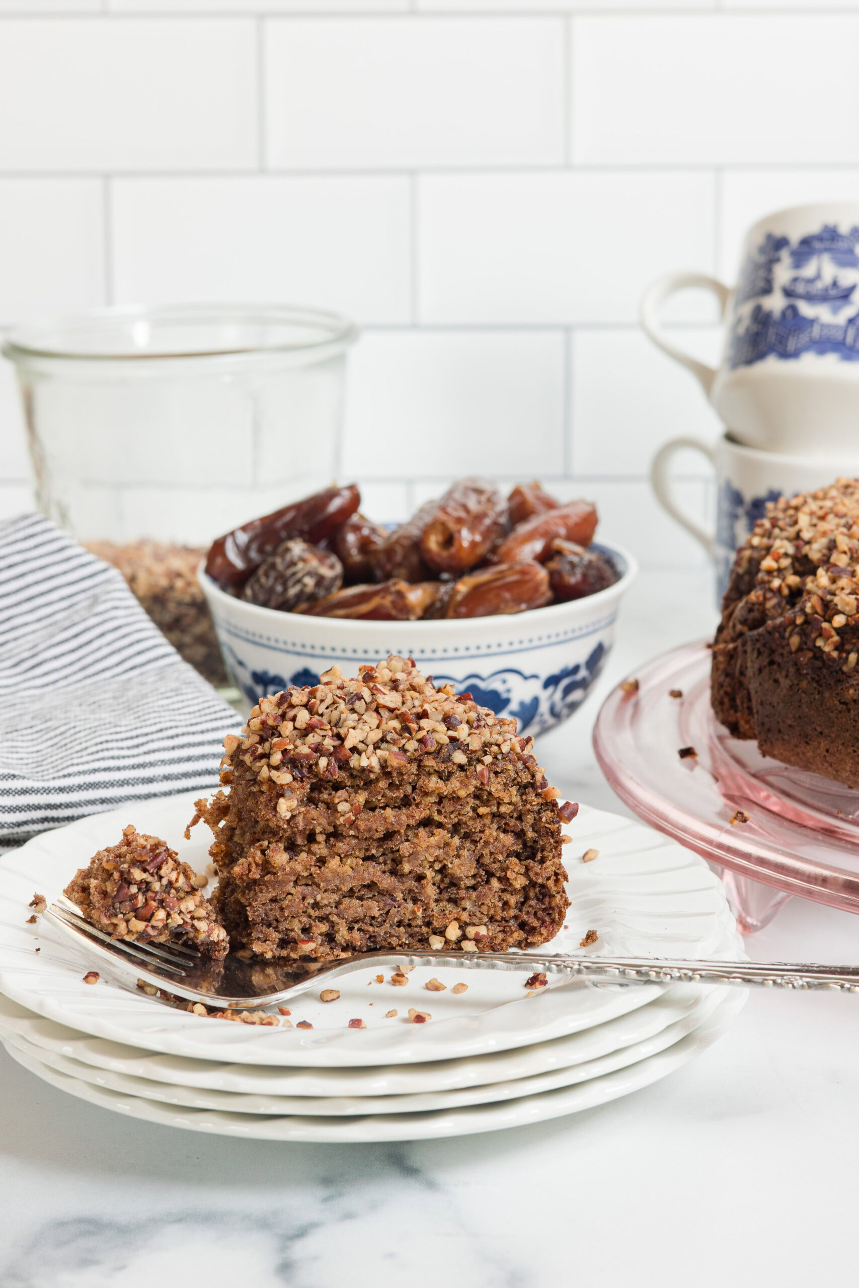 slice of date and almond cake on a plate
