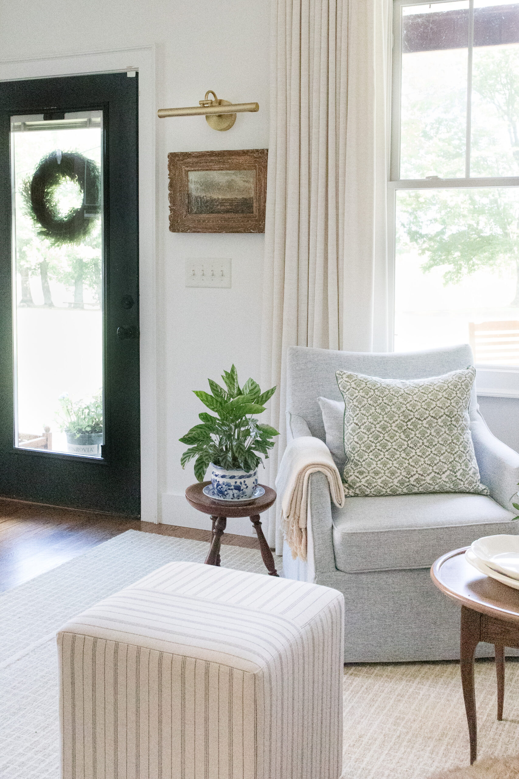 sitting room with chairs and painting with light